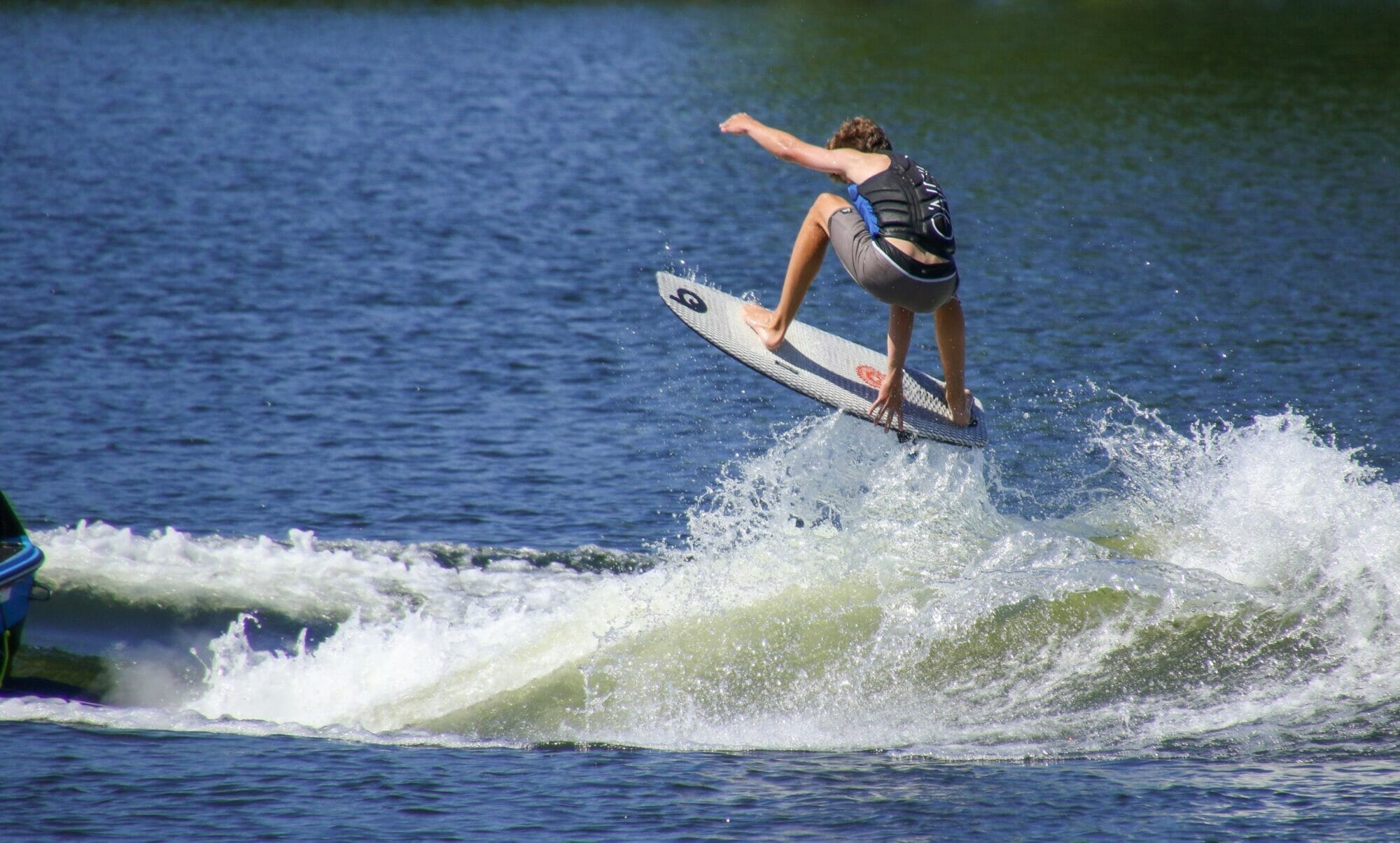 A man is riding a surfboard.