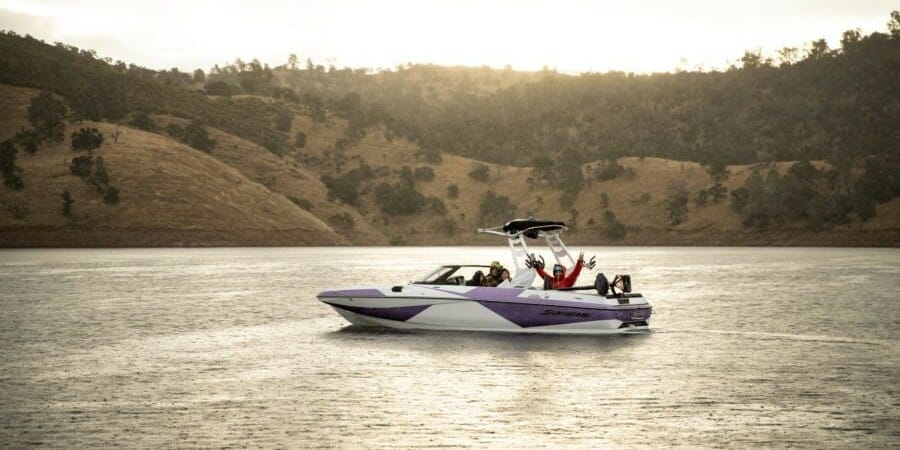 A Supreme speed boat on a lake.