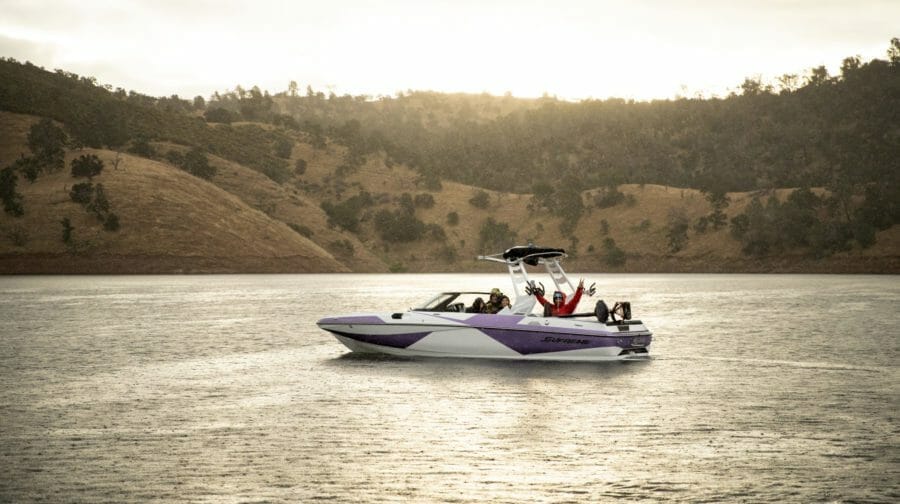 A Supreme speed boat on a lake.