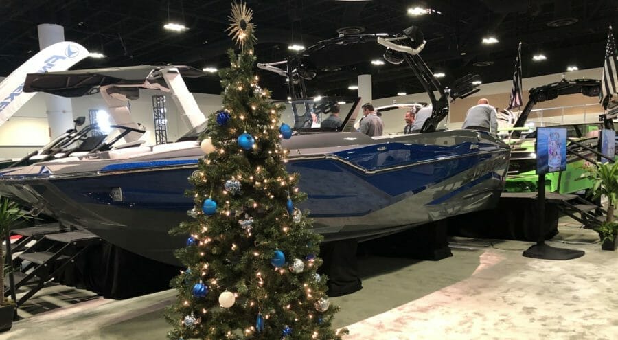 A Supreme Boats at a boat show displaying a christmas tree.