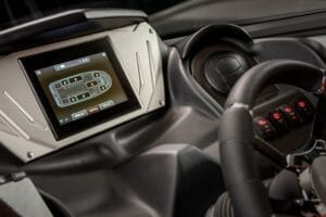 The dashboard of a car with a GPS screen displaying Supreme Boats.