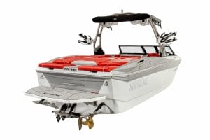 A white and red boat with a Supreme logo on a red seat.