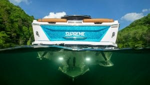 A Supreme boat is floating in the water.