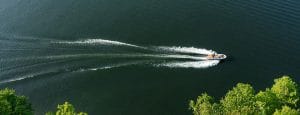 Aerial view of a Supreme speed boat on a lake.