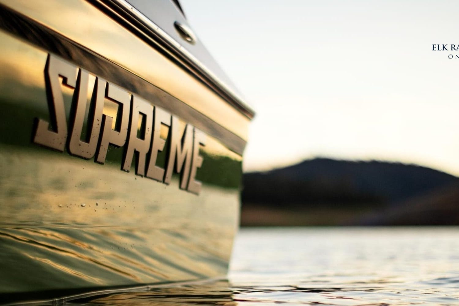 Close-up of a green Centurion boat on a lake with 